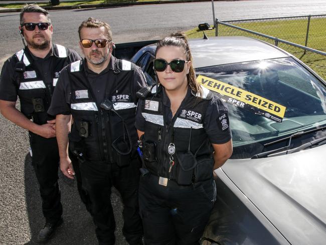 SPER enforcement team leader Daniel Armstong (centre) with agents David Lyon and Emma Love standing with a vehicle they siezed in Kingaroy for outstanding SPER debts. Picture: Dominic Elsome