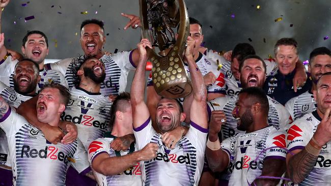 SYDNEY, AUSTRALIA - OCTOBER 25: Cameron Smith of the Storm holds aloft the Premiership trophy and celebrates with team mates after winning the 2020 NRL Grand Final match between the Penrith Panthers and the Melbourne Storm at ANZ Stadium on October 25, 2020 in Sydney, Australia. (Photo by Cameron Spencer/Getty Images)