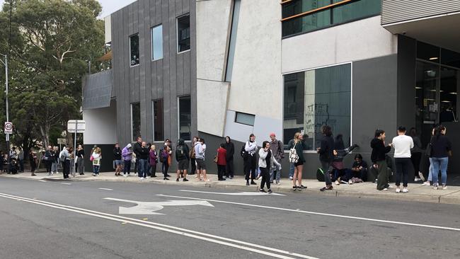 People queue around the block at a Centrelink in Melbourne. Picture: Tessa Akerman.