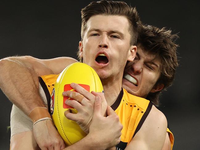 MELBOURNE, AUSTRALIA - JULY 10: Mitch Lewis of the Hawks marks in front of Jordon Butts of the Crows during the round 17 AFL match between the Hawthorn Hawks and the Adelaide Crows at Marvel Stadium on July 10, 2022 in Melbourne, Australia. (Photo by Robert Cianflone/Getty Images)