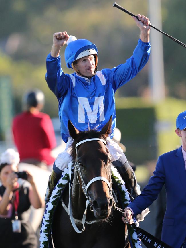 Jockey Hugh Bowman Winx gestures to the crowd after winning The Star Doncaster Mile on Winx.