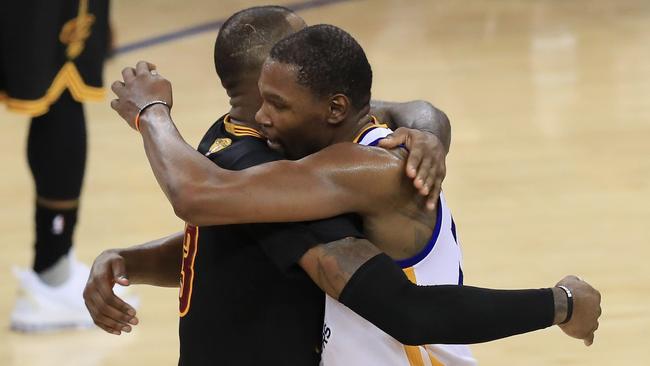 LeBron James hugs Kevin Durant after the game. Picture: AFP