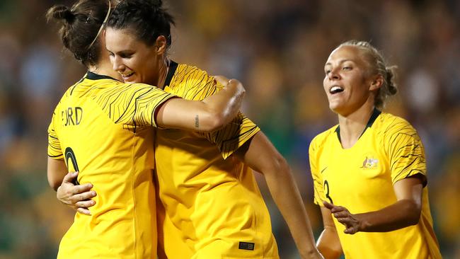 Emily Gielnik of the Matildas (centre) is congratulated by teammates Caitlin Foord (left) and Tameka Butt. Picture: Getty Images