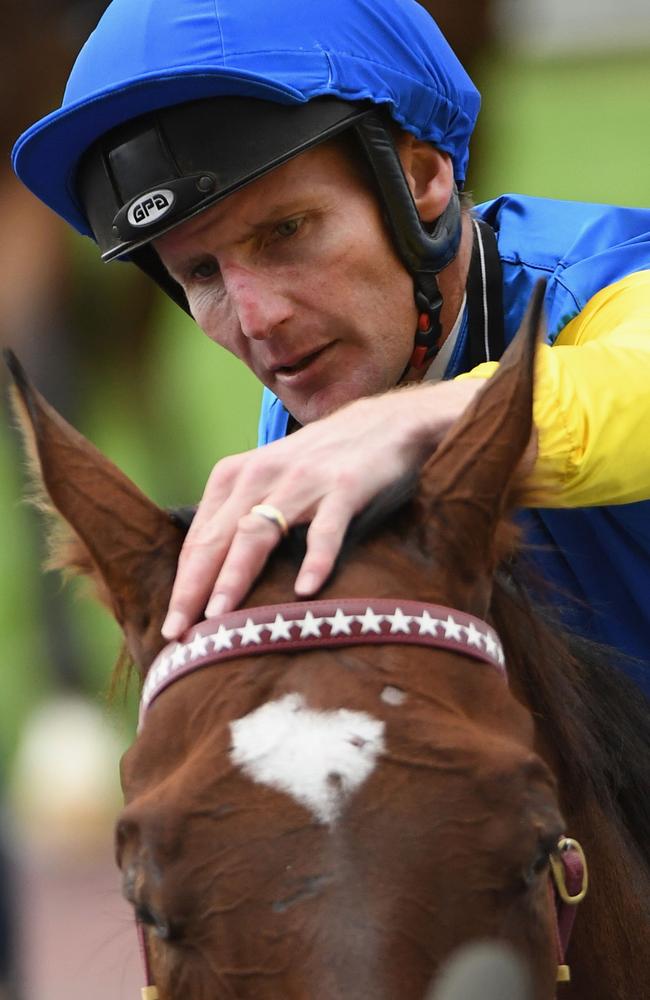 Brad Rawiller pats Black Heart Bart after winning at Caulfield in March. Picture: Getty Images