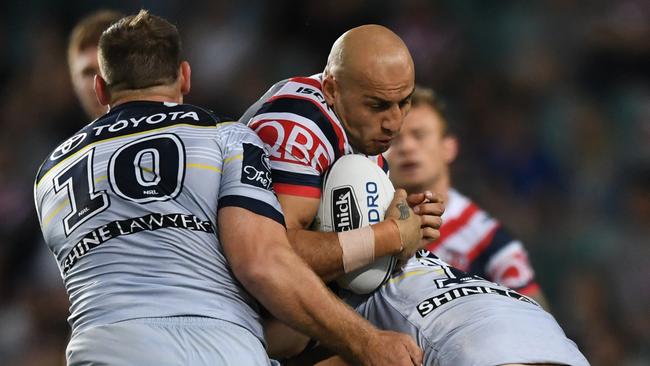 Roosters winger Blake Ferguson runs into the Cowboys defence.