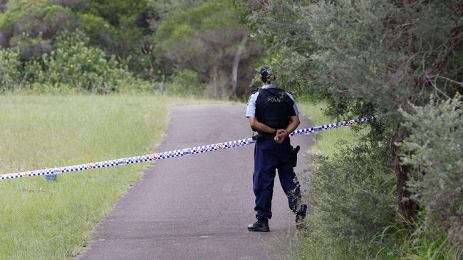 A police officer guards the scene, which is cordoned off. Picture: Damian Shaw