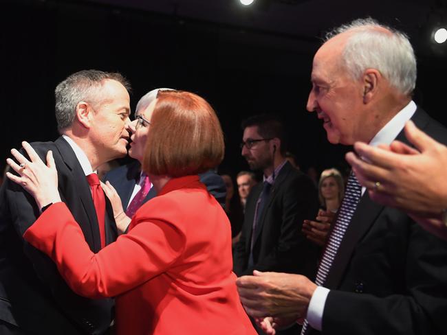 Australian Opposition Leader Bill Shorten (left) is welcomed by former Australian Prime Ministers Kevin Ruff, Julia Gillard and Paul Keating as he arrives at the Labor Party campaign launch for the 2019 Federal election at the Brisbane Convention Centre in Brisbane, Sunday, May 5, 2019. A Federal election will be held in Australian on Saturday May 18, 2019. (AAP Image/Lukas Coch) NO ARCHIVING