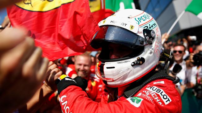 Germany’s Sebastian Vettel celebrates with his Ferrari crew after winning the British Grand Prix at Silverstone. Picture: Getty Images