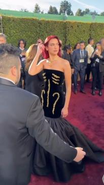 Dua Lipa arrives at the 2024 Golden Globes