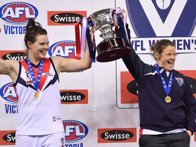 Darebin Falcons captain Elise O'Dea and coach Jane Lange celebrate with the trophy after defeating Diamond Creek during the VFL Women's Grand Final at Etihad Stadium in Docklands, Sunday, Sept. 24, 2017. (Picture/Andy Brownbill