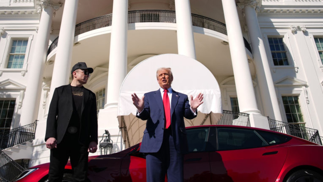 That is, of course, the White House behind them. Picture: Andrew Harnik/Getty Images