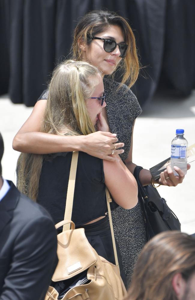 Home And Away star Pia Miller comforts a mourner at Jessica’s funeral. Picture: Media Mode