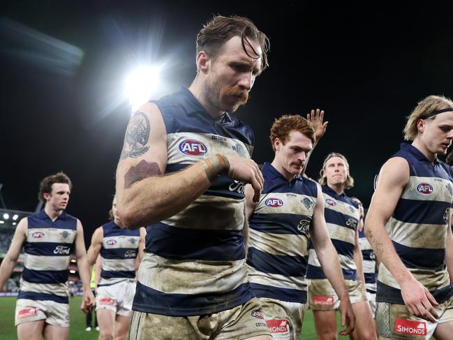 MELBOURNE, JULY 20, 2024: 2024 AFL - Round 19 - Geelong Cats V Western Bulldogs at GMHBA Stadium. Geelong Cat Zach Tuohy and a dejected Geelong leave the field after the loss. Picture: Mark Stewart