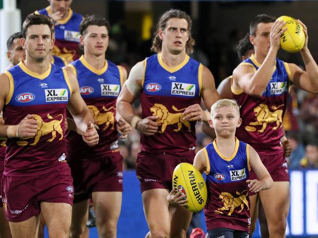 BRISBANE, AUSTRALIA - MAY 07: Brisbane Lions enter the field during the 2022 AFL Round 08 match between the Brisbane Lions and the West Coast Eagles at the Gabba on May 07, 2022 in Brisbane, Australia. (Photo by Russell Freeman/AFL Photos via Getty Images)