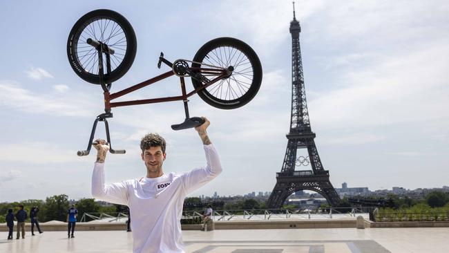 Torch bearer Matthias Dandois poses for a photo at Place du Trocadero with the Eiffel Tower in view during the second day of the Paris 2024 Olympic Torch Relay. Picture: Getty Images