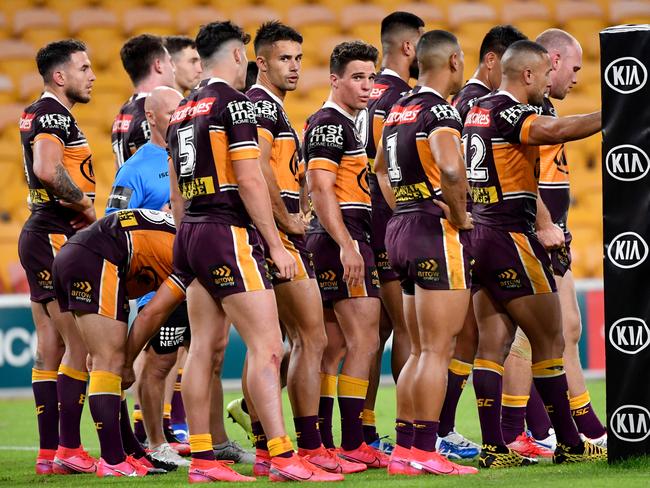 Brodie Croft (centre) of the Broncos is seen with team mates after a Luke Keary of the Roosters scored a try during the Round 4 NRL match the Brisbane Broncos and the Sydney Roosters at Suncorp Stadium in Brisbane, Thursday, June 4, 2020. (AAP Image/Darren England) NO ARCHIVING, EDITORIAL USE ONLY