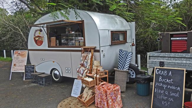 A coffee van near Lammermoor Beach was giving out free coffees to people helping to pick up debris that had washed up on the beach. Photos: Malcolm Wells