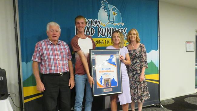 Alex Couldrey (2nd left) and Demi Caldwell (2nd right) congratulated by John Claydon (left) and Sharon Stewart-Harris (right) with taking out the Forsyth's Shawn Claydon Memorial Shield 10km Club Championship perpetual Trophy at the Mackay Road Runners awards ceremony. Picture: Contributed