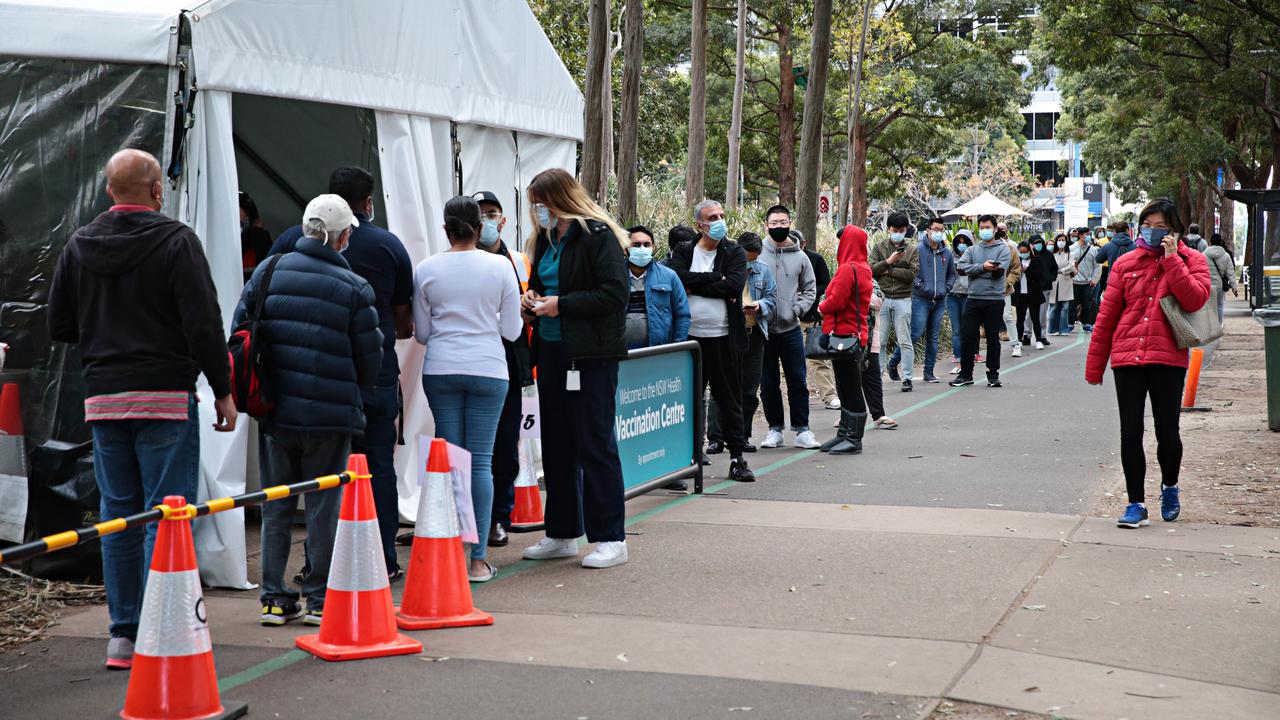 Thousands of people line up at Sydney's Olympic Park vaccination each day for a vaccine. Picture: NCA NewsWire / Adam Yip