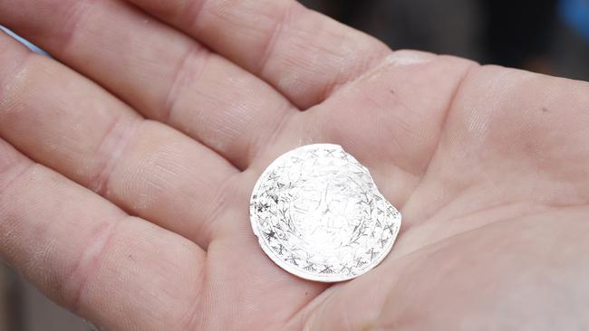 Engraved disk. An archaeological dig at the vacant site adjacent to the Hope &amp; Anchor pub in Hobart has uncovered some treasures from years gone by. Picture: Nikki Davis-Jones