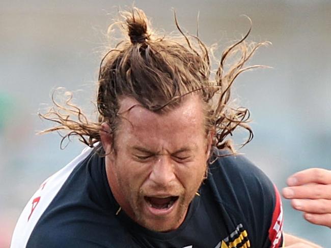 CANBERRA, AUSTRALIA - MAY 25: Ashton Sims of the Cowboys is tackled during the round 11 NRL match between the Canberra Raiders and the North Queensland Cowboys at GIO Stadium on May 25, 2014 in Canberra, Australia. (Photo by Stefan Postles/Getty Images)