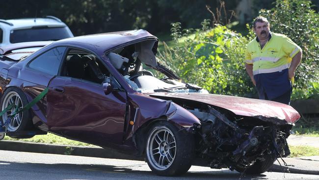 The wrecked car is towed from the scene today. Picture: Tim Hunter.