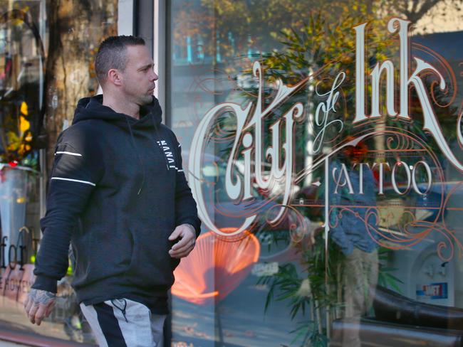 King outside his tattoo parlour after shots were fired at the store. Picture: David Crosling