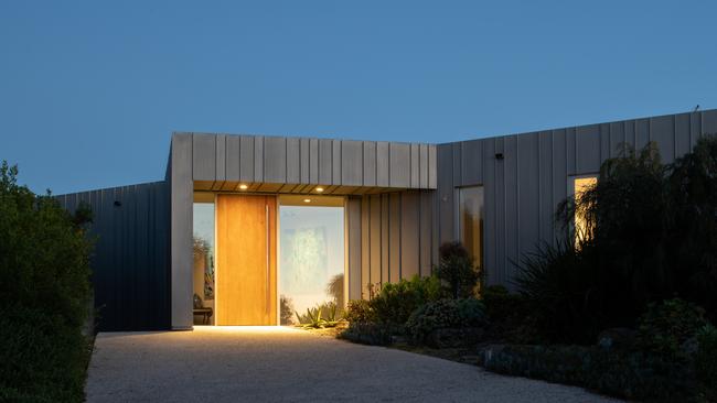 Low Head Beach House makes a striking shape against the landscape.