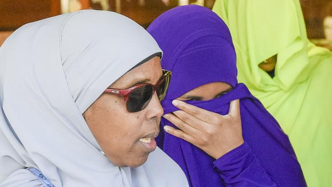 Abdirahman Khalif, in purple, leaves court following her acquittal. Picture: Roy Vandervegt.