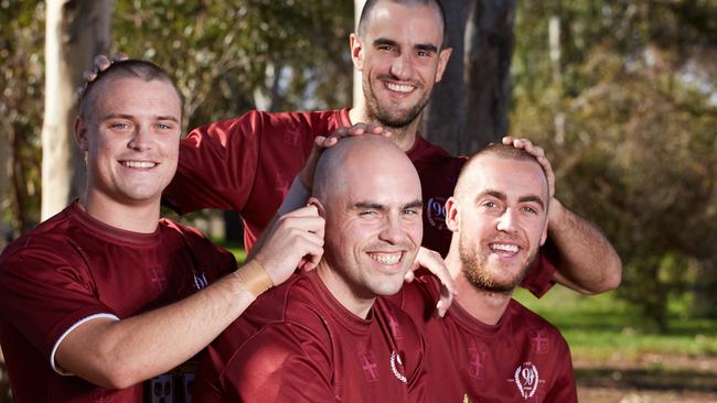 Teammates Justin Graetz, James Dalwood, James Thomas and Tom Brinsley ... shave their heads to raise money for little Eddie. Picture: Matt Loxton