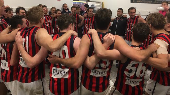 East Malvern players sing the song after their win over Dingley.