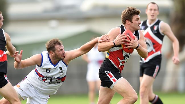 Gary Carpenter bursts through a tackle for Bonbeach. Picture: Chris Eastman.