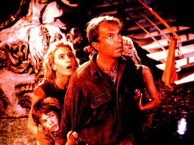 Actor Sam Neill with Laura Dern in scene from film "Jurassic Park".