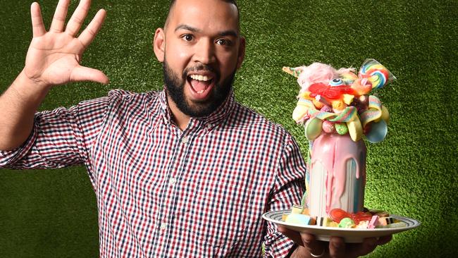 Sugar Buns owner Steven Richard with a ‘Candyland' mega shake. Picture: Jason Sammon