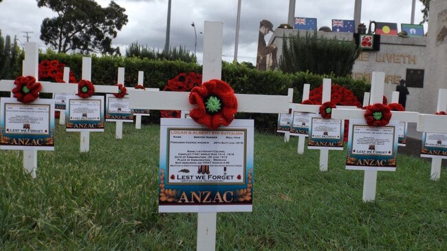 Mic Noble’s 50white crosses are a tribute for thie diggers on Anzac Day after the Logan Central RSL sub-branch folded. Families can view the images online on Anzac Day AAP/Image Sarah Marshall