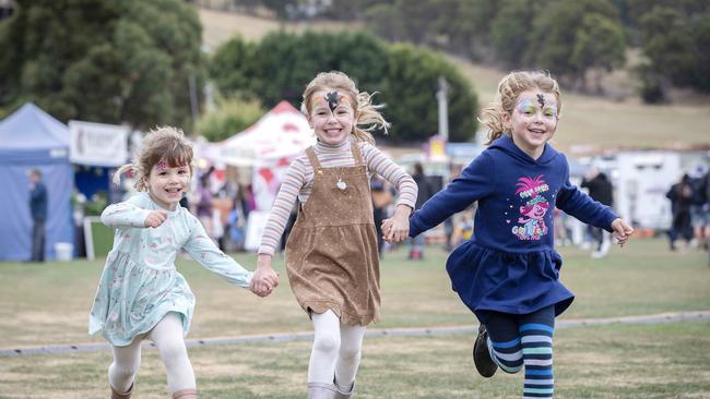 Lucy van Beest 3, Lilah van Beest 5 and Amelia Marris 5 all of Hobart at A Taste of the Huon. Picture: Chris Kidd