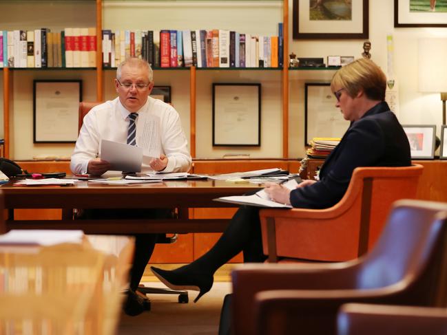 Prime Minister Scott Morrison talks with Minister for Defence Linda Reynolds after learning of the Cyberattack  in Australia from a foreign state. Picture: Adam Taylor/PMO