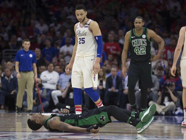 PHILADELPHIA, PA - MAY 7: Ben Simmons #25 of the Philadelphia 76ers looks at Marcus Smart #36 of the Boston Celtics while he is on the ground with an apparent injury in the second quarter during Game Four of the Eastern Conference Second Round of the 2018 NBA Playoffs at Wells Fargo Center on May 7, 2018 in Philadelphia, Pennsylvania. NOTE TO USER: User expressly acknowledges and agrees that, by downloading and or using this photograph, User is consenting to the terms and conditions of the Getty Images License Agreement.   Mitchell Leff/Getty Images/AFP == FOR NEWSPAPERS, INTERNET, TELCOS & TELEVISION USE ONLY ==