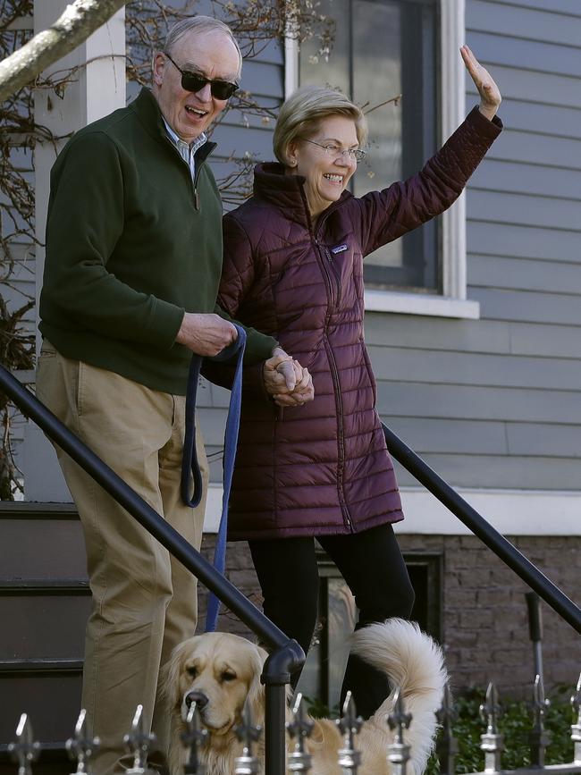 Sen. Elizabeth Warren, D-Mass., with her husband Bruce Mann, and dog Bailey. Picture: AP