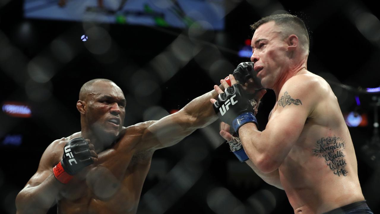 UFC welterweight champion Kamaru Usman punches Colby Covington in their welterweight title fight during UFC 245.