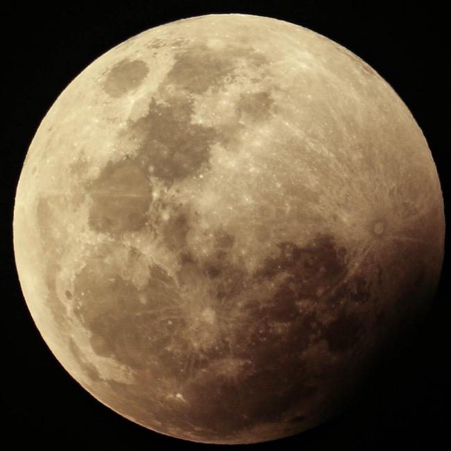 The super blood full moon seen over Darwin on Wednesday night. Pictures: Glenn Campbell