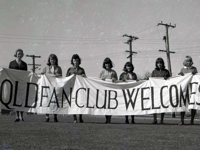 Beatles fans prepare to welcome their idols with a 20-foot banner, from left: Margaret Sims, 15, of Clayfield; Marilyn Dean, 16, of Mitchelton; Lorraine Watson, 15, of Graceville; Dianne Hauritz, 16, of New Farm; Gay Croes, 17, of Salisbury; Kay Hawthorne (Beatle fan club president), 17, of Aspley; Lesley McHugh, 17, of Kedron; Kathy O’Brien, 17, of Bardon; and Gay Seresheff, 18, of Salisbury. Picture by Jim Fenwick. Picture: News Corp