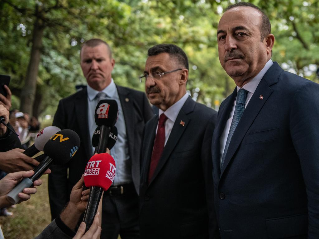 Turkey's Vice-President Fuat Oktay, right, and Foreign Minister Mevlut Cavusoglu speak to the media after visiting Al Noor mosque  in Christchurch, New Zealand. Picture: Getty