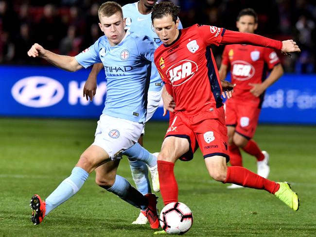 United’s Craig Goodwin to take a shot on goal. 