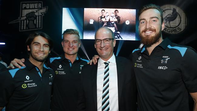 Happier times: Port Adelaide chairman David Koch with players at Port's season launch.