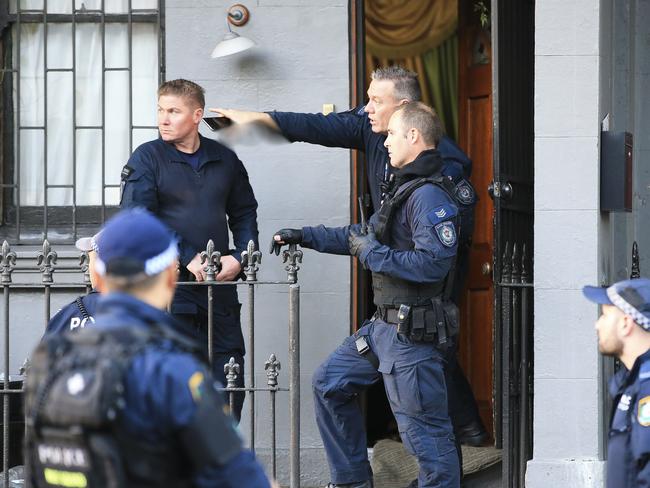 Police outside the Surry Hills terrace house. Picture: Dylan Robinson