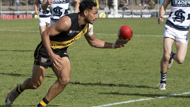 Glenelg’s Marlon Motlop appeared to have the ball on a string in the Tigers’ 14th consecutive win against South Adelaide at the Bay on Saturday. Picture: Emma Brasier