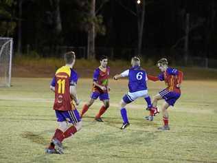 READY TO FLY: Sunbury's Tyson Bedford surrounded by KSS Jets players in a match earlier this year. Picture: Brendan Bowers