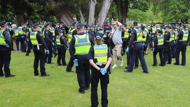 Dozen of police have surrounded the group. Picture: Alex Coppel