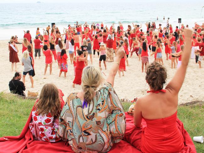 V DAY: In the early morning light on Main Beach on Friday around 350 women men and children gathered and danced in support of the global One Billion Rising movement to stop violence against women.  Photo Veda Dante / Byron Shire News